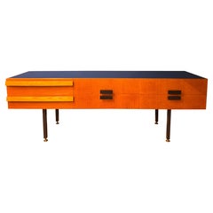 A 1960s Italian 6 drawers credenza with cobalt blue glass top