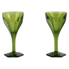 Baccarat, France. Two Tallyrand green wine glasses in faceted crystal glasss