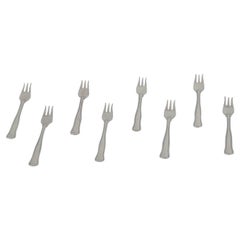 Georg Jensen. Juego de ocho tenedores de repostería "Old Danish" de plata de ley.