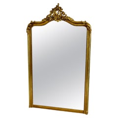Antique A Large Elaborate French Rococo Gilt Console Mirror Decorated with Scrolls