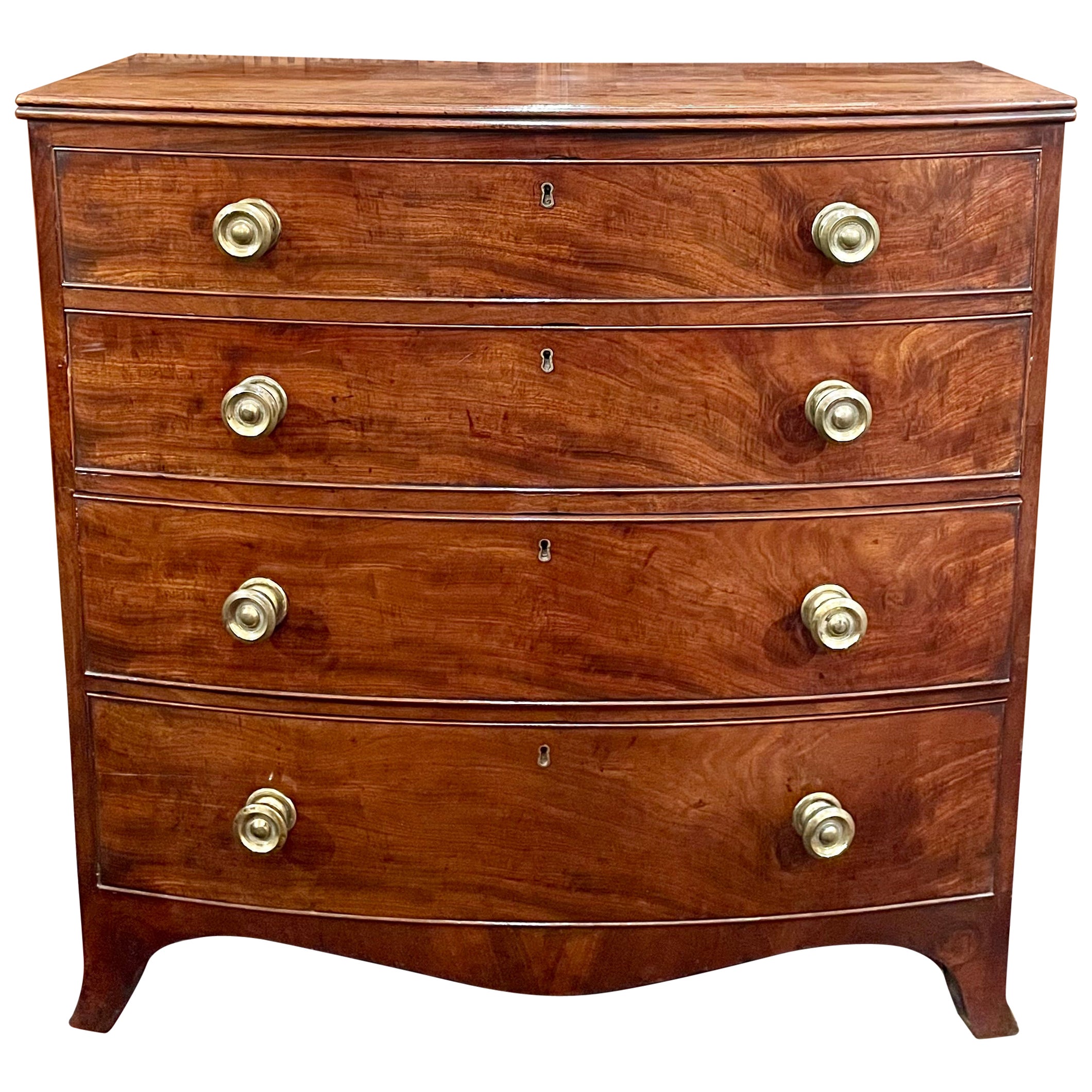 Antique English Flamed Mahogany Bowfront Chest, Circa 1860.