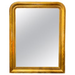 Espejo Louis Philippe dorado con motivos florales del siglo XIX