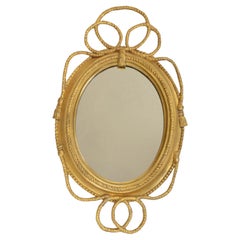 Miroir ovale doré de style Régence