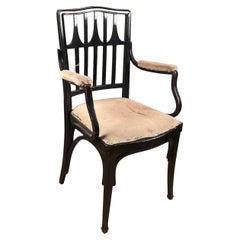 J & J Kohn , poltrona in legno annerito, schienale traforato, circa 1880