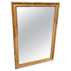 18th Century Louis XVI Period Mirror, Carved and Gilded Wood.