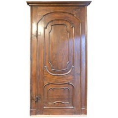 Antique Single-leaf poplar door with arched panel and carved panel, Italy