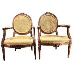 Pair of French Louis XVI Walnut Armchairs or Fauteuils, Hand Carved