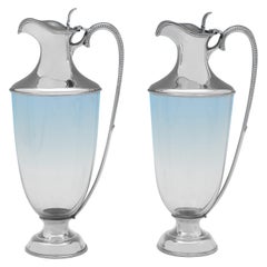 Stylish and rare pair of antique sterling silver claret jugs made in 1918