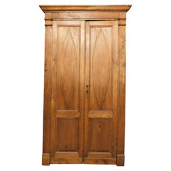 Puerta de dos hojas, de madera de álamo con paneles tallados y marco, Italia
