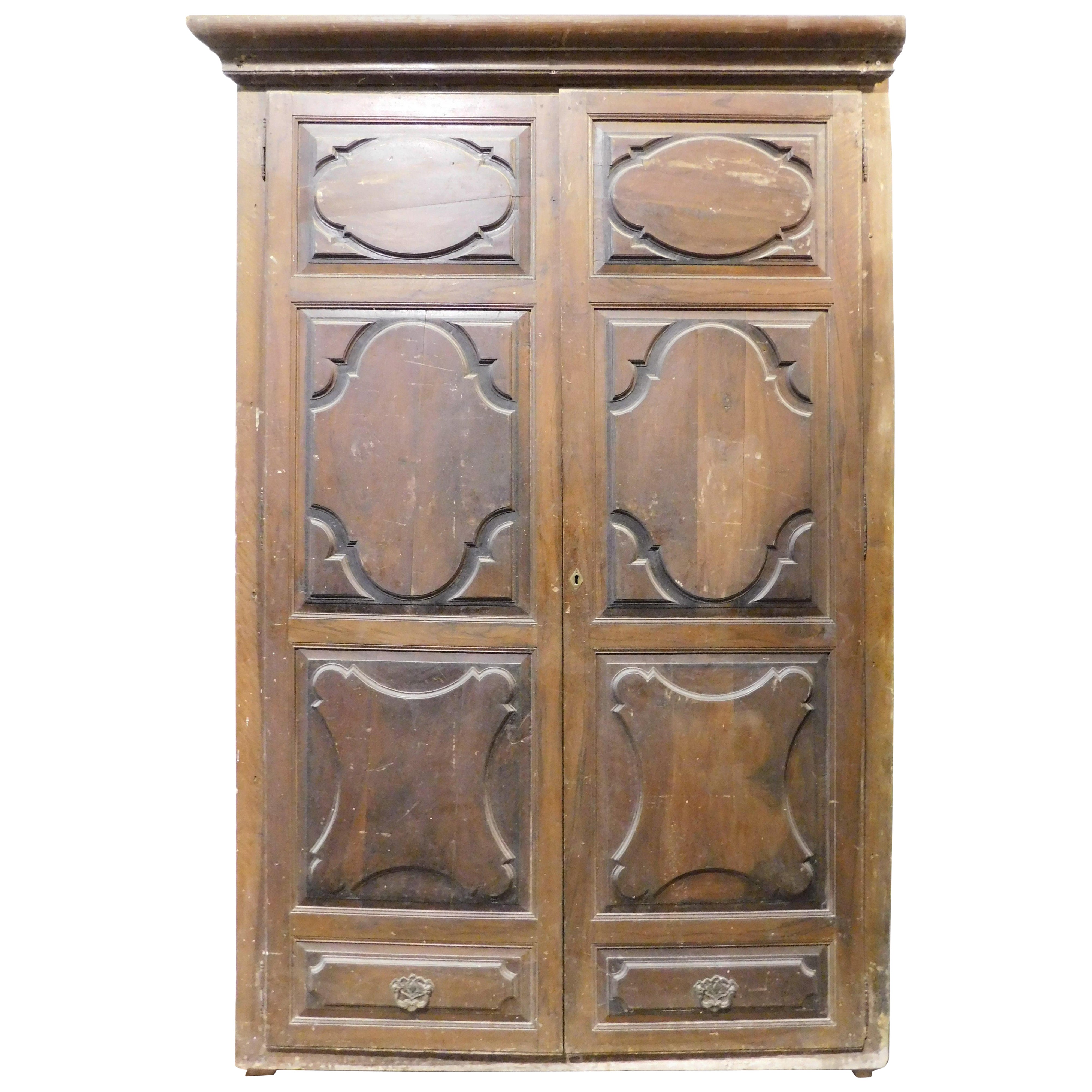Walnut wall plaque, carved two-door wardrobe front, Italy