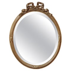 Antique French Louis XVI Specchio da parete ovale in legno dorato