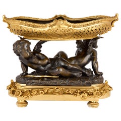Centro de mesa antiguo de querubín dorado y bronce patinado de Moreau