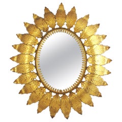 Espejo oval de hierro dorado con marco de hojas, España Años 50