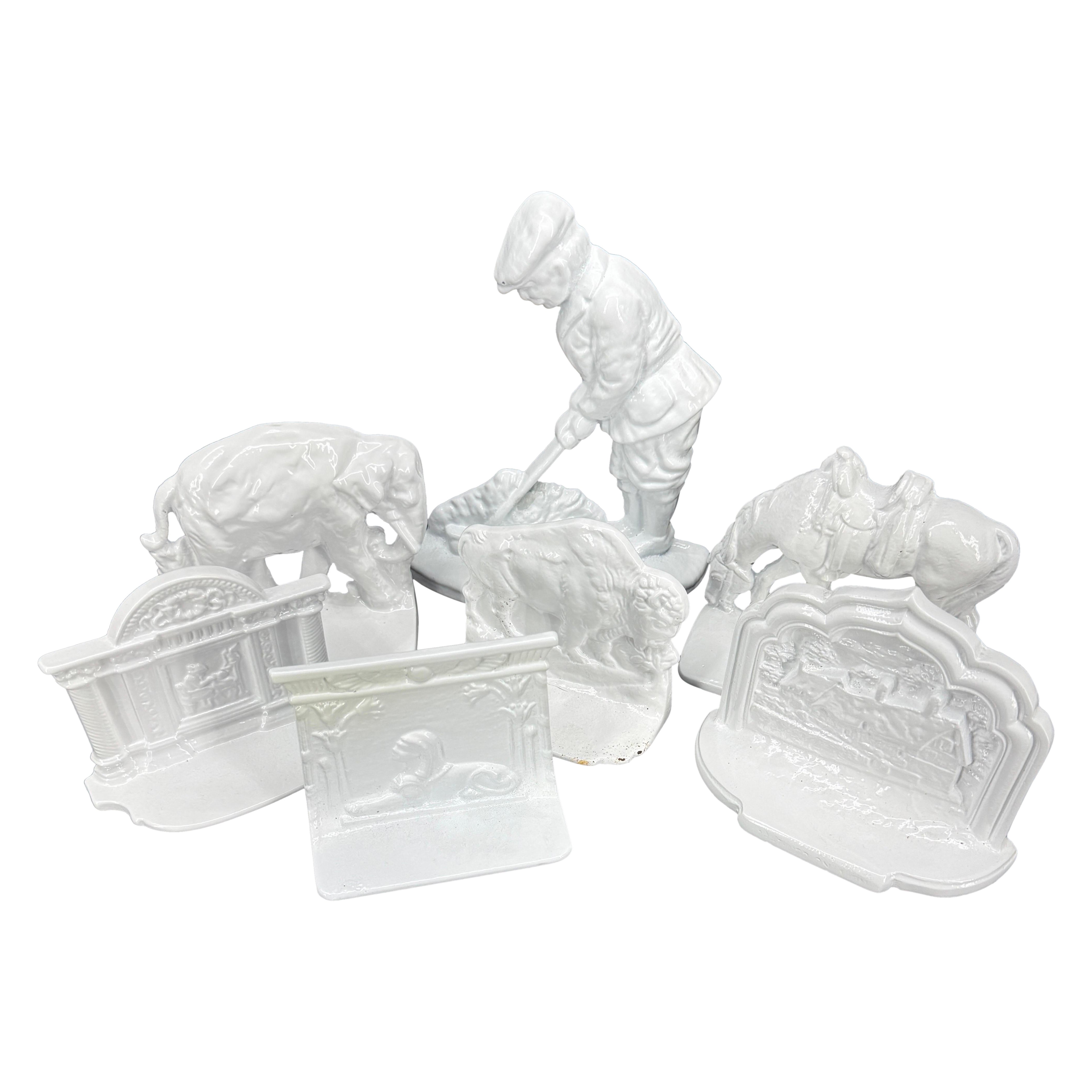 Collection of 7 White Powder Coated Cast Iron Bookends