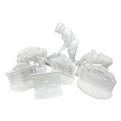 Collection of 7 White Powder Coated Cast Iron Bookends