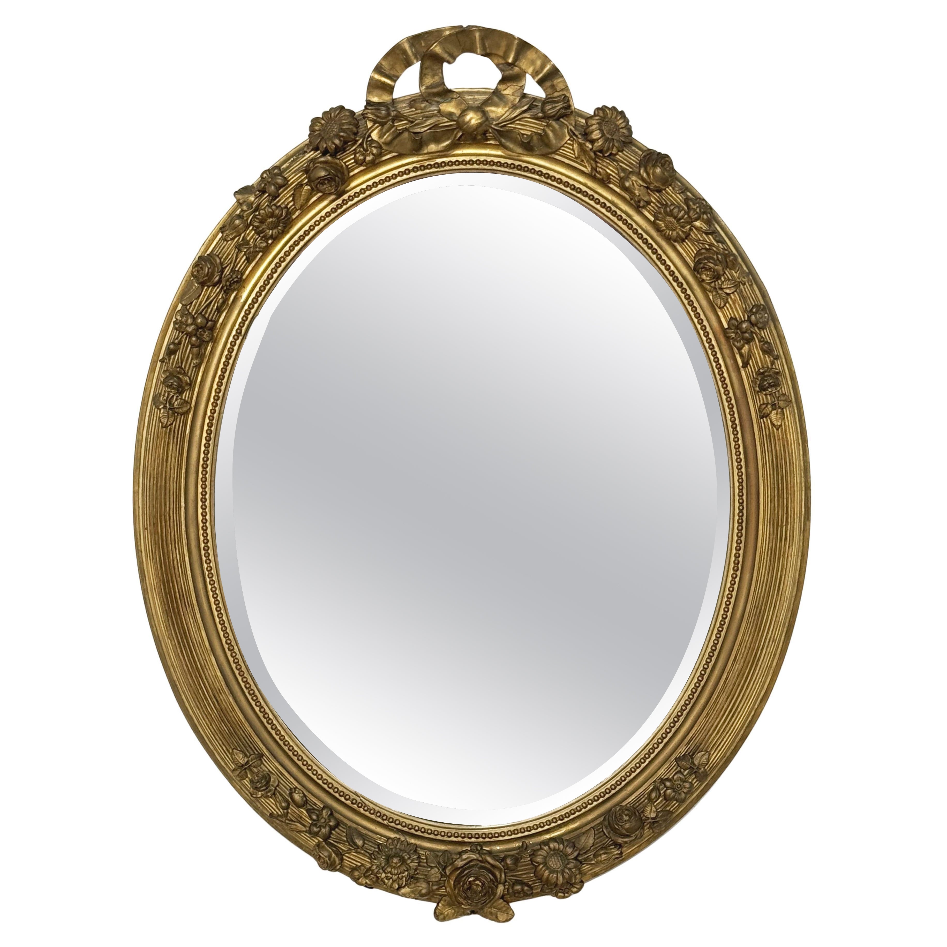 Large French Gilt Oval Beveled Wall Mirror with Ribbon Tied Crest and Frieze