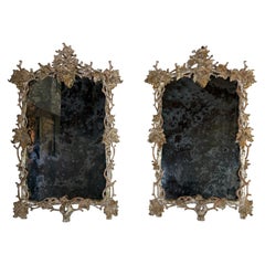 Pair of Monumental Silvered Carved Vine Mirrors