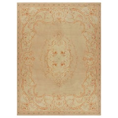 Tappeto Aubusson antico in beige e arancione con medaglione floreale - Rug & Kilim
