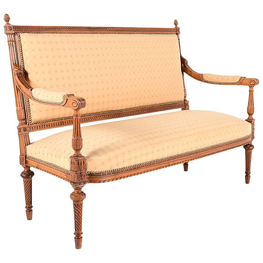 Highly carved and detailed, the superior quality in this gorgeous, French, Louis XVI-style, carved walnut parlour suite is obvious.

Settee: 53.5” wide x 27” deep x 39.5” tall. Chairs: 24” wide x 20.5” deep x 36” tall x 17” floor-to-seat.

