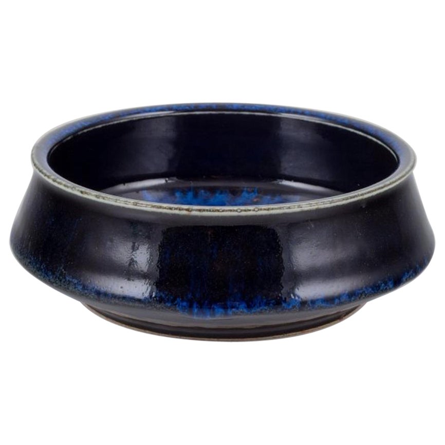 Carl Harry Stålhane for Rörstrand. Ceramic bowl with blue tones glaze.