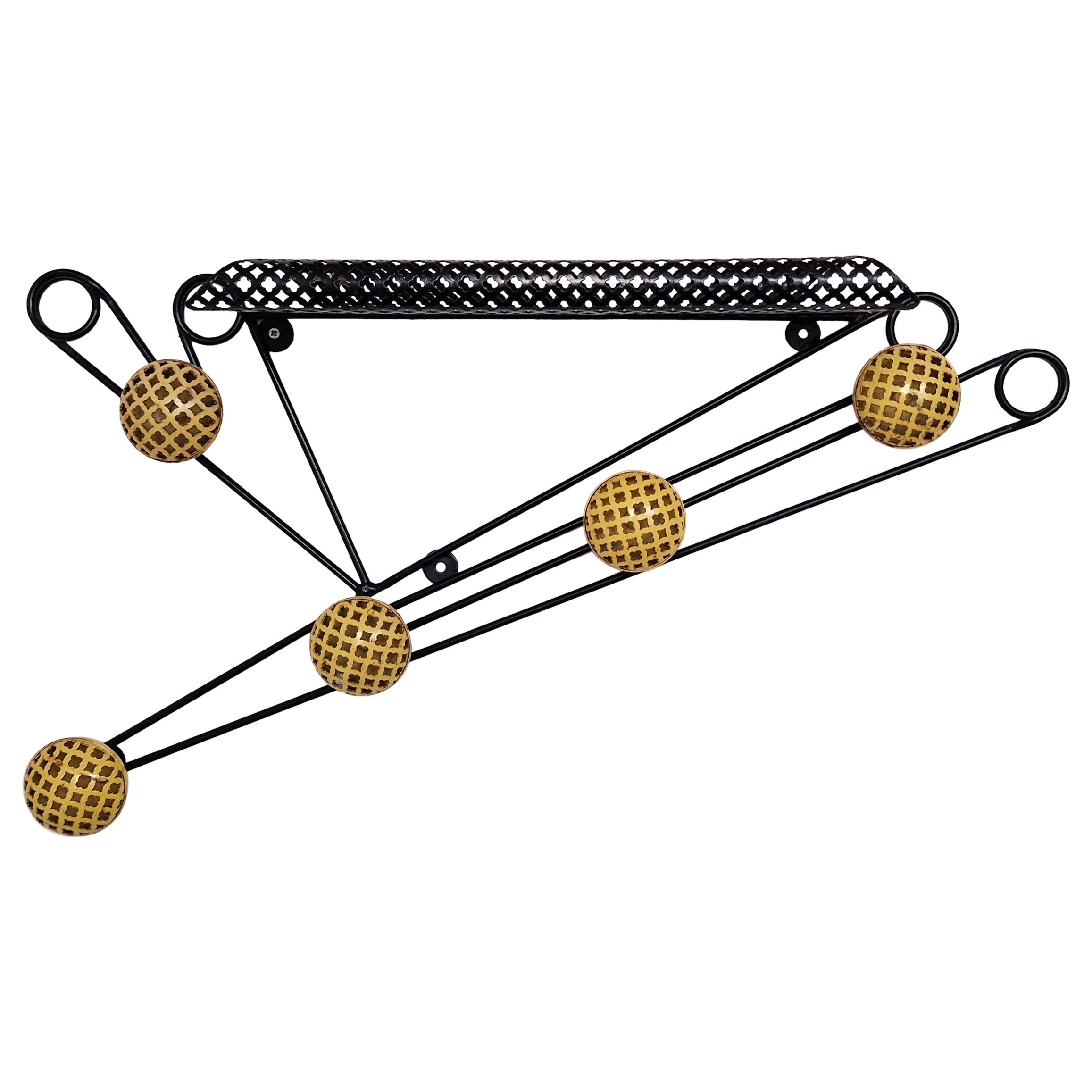 Black and yellow wall coat rack in the style of Matégot and Feraud, France 50s