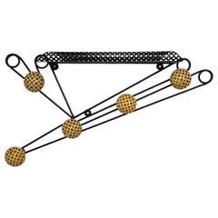 Black and yellow wall coat rack in the style of Matégot and Feraud, France 50s