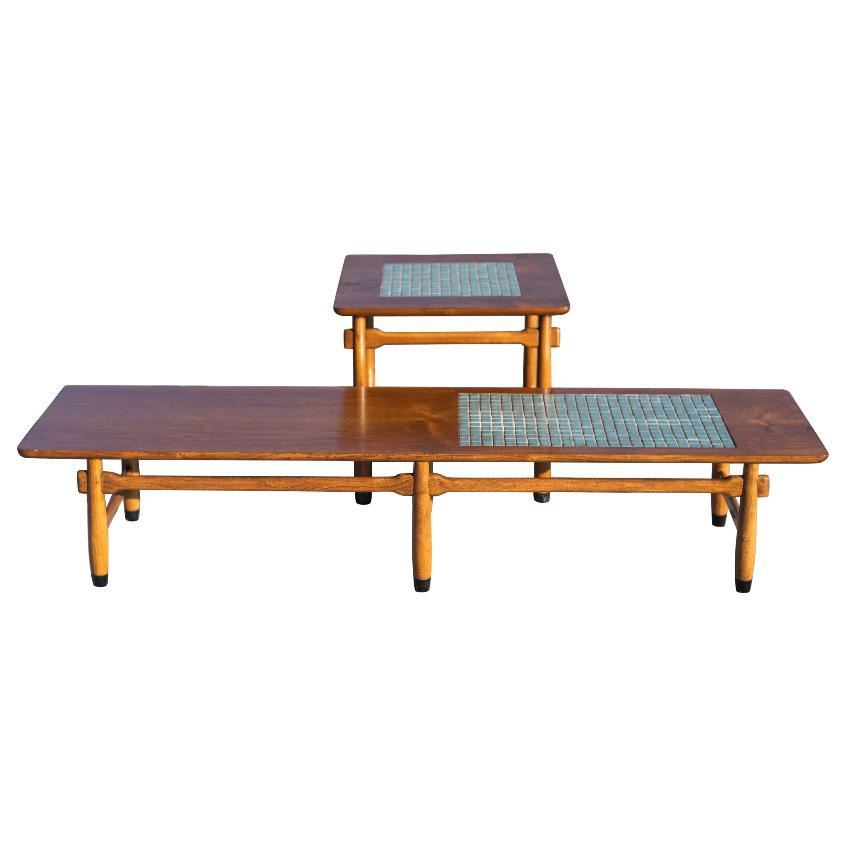 Designed and made in the United States in the 1960s, this set of tables features high-quality walnut construction and inlays of square blue cermic tiles. The grain is nicely figured, and the cermaic is saturated and bright depite its age. Each leg