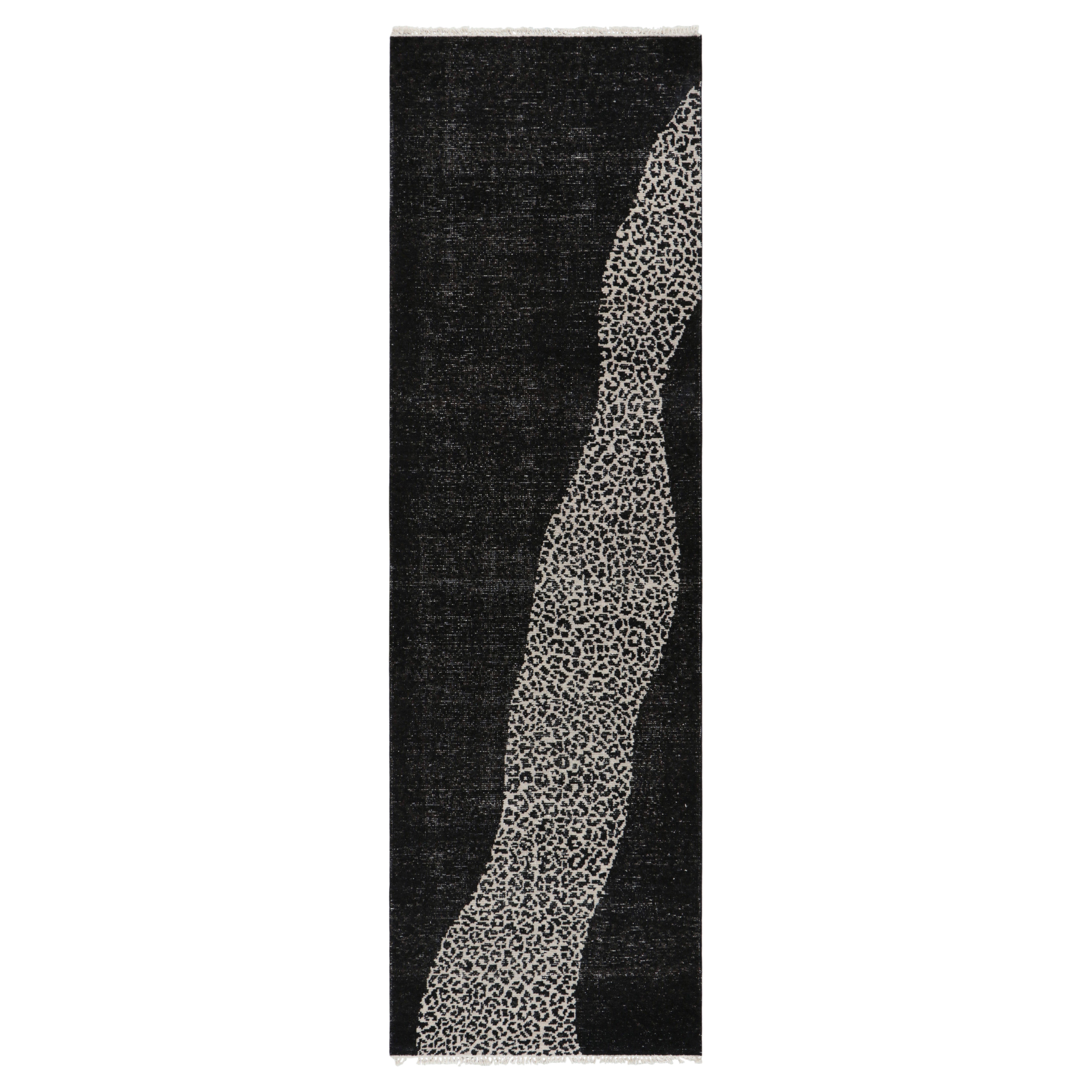 Rug & Kilim’s Distressed Runner Rug with Black and White Abstract Patterns