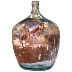 French Hand Blown Demijohn Glass Bottle and Gilt with "Vacqueyras" Crest