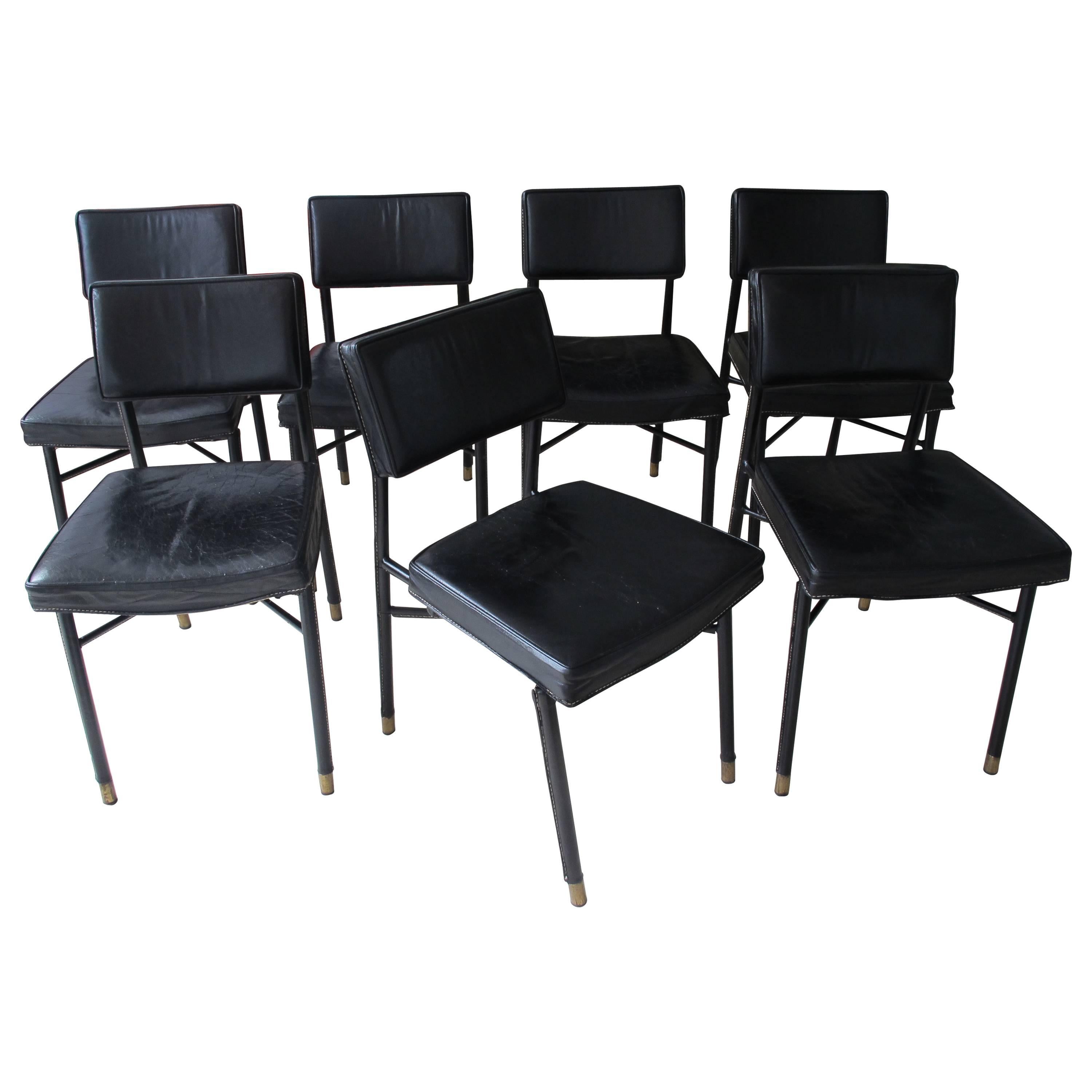 Set of Seven Stitched Leather Dining Chairs by Jacques Adnet 