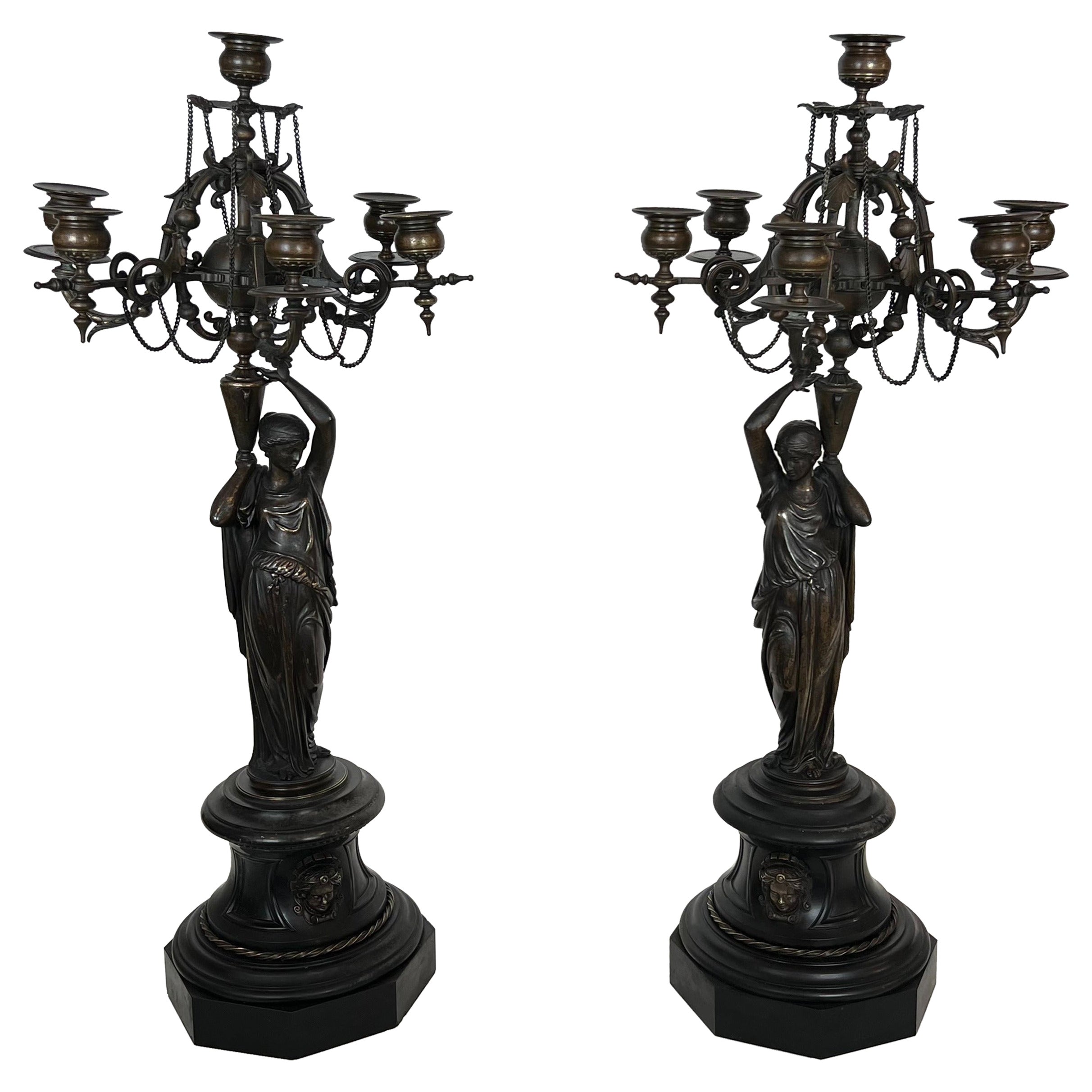 Pair of Important Candelabra in Patinated Bronze Presenting Caryatids Carrying For Sale