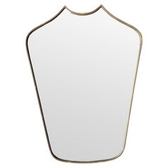 A great shaped orignal Italian 1950s shield mirror with brass beaded frame