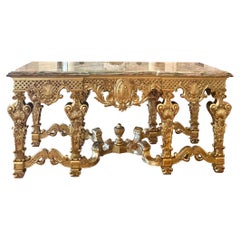 Impressionnante table centrale de style Régence française avec plateau en onyx et bois doré