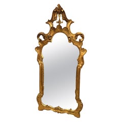 Ravissant miroir mural de style baroque doré