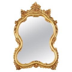 20th Century Baroque gilded shaped oval mirror, France