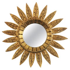 Espejo en forma de flor / Espejo Sunburst en madera dorada, años 50