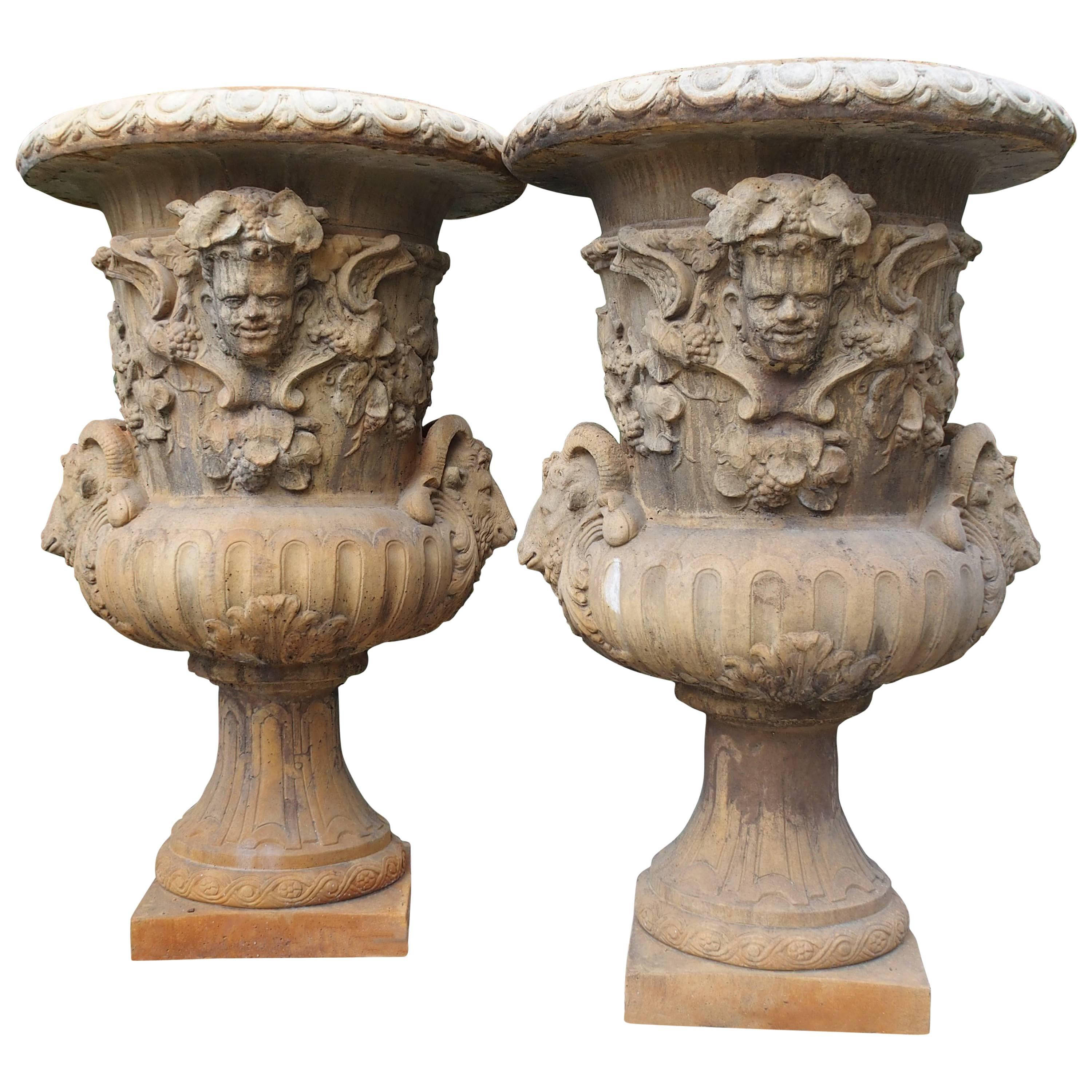 Pair of Large European Cast Garden Urns with Mascarons, Rams Heads, and Grape 