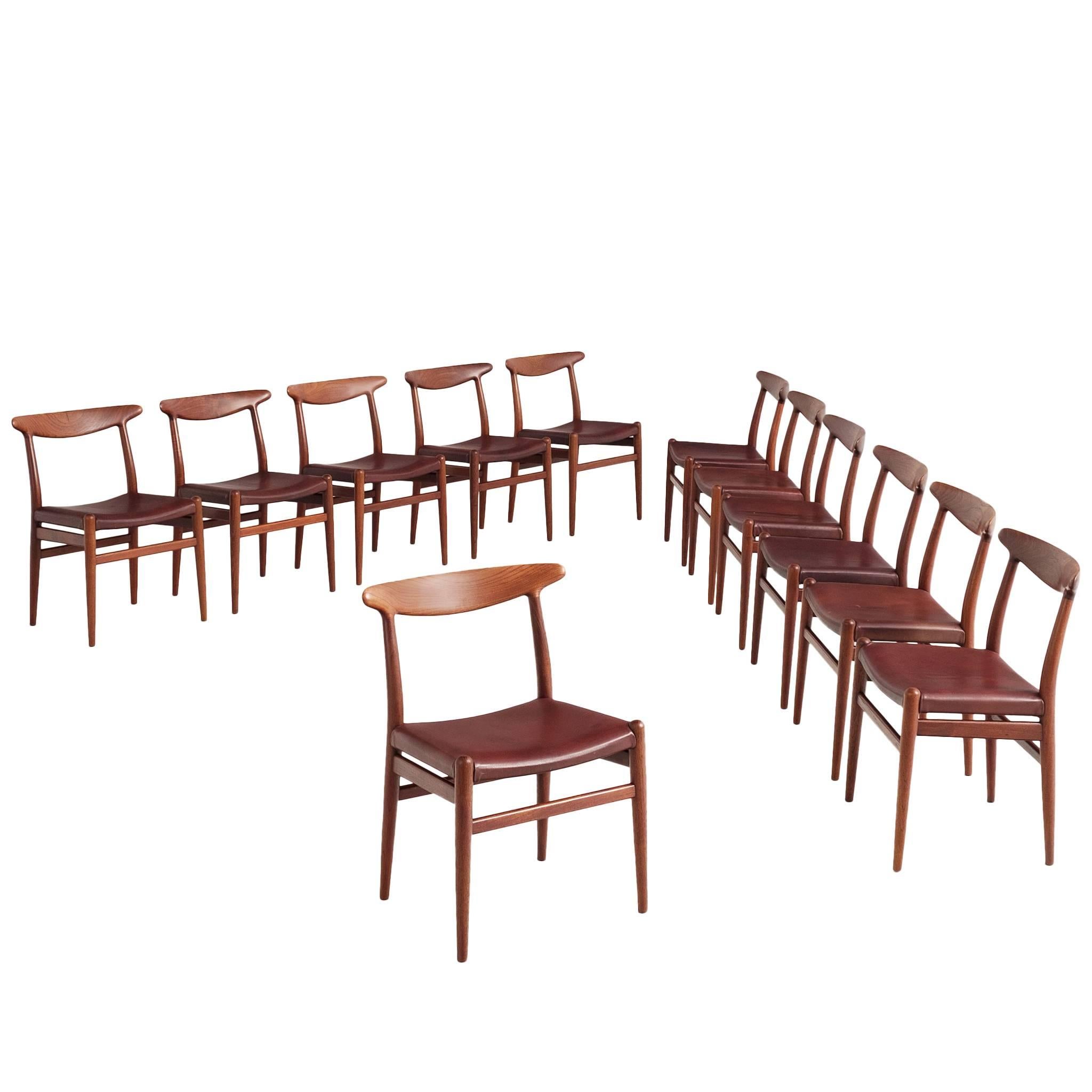 Early Set of 12 Hans J. Wegner Chairs with Original Leather