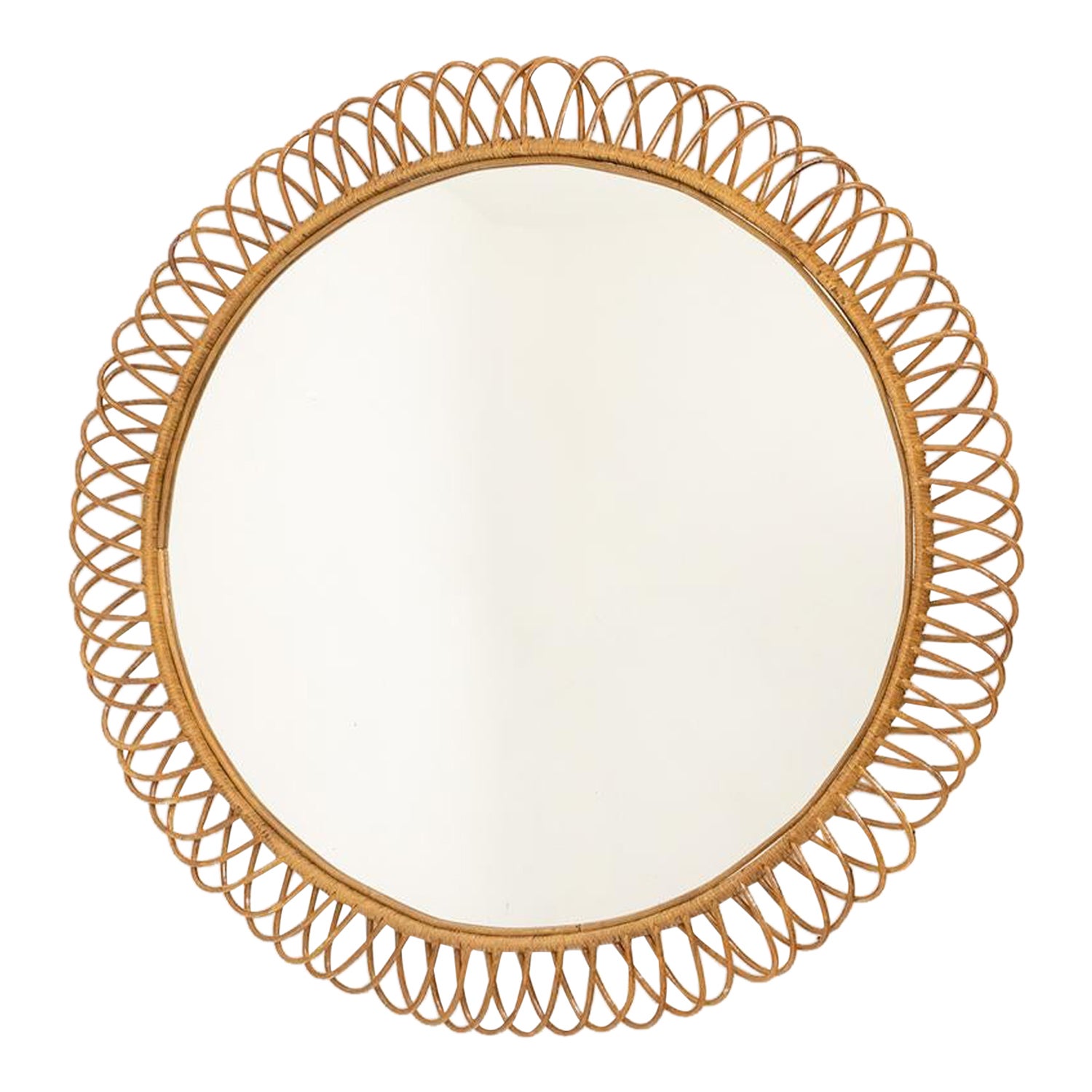 Round rattan mirror with interlacing. 1980s.