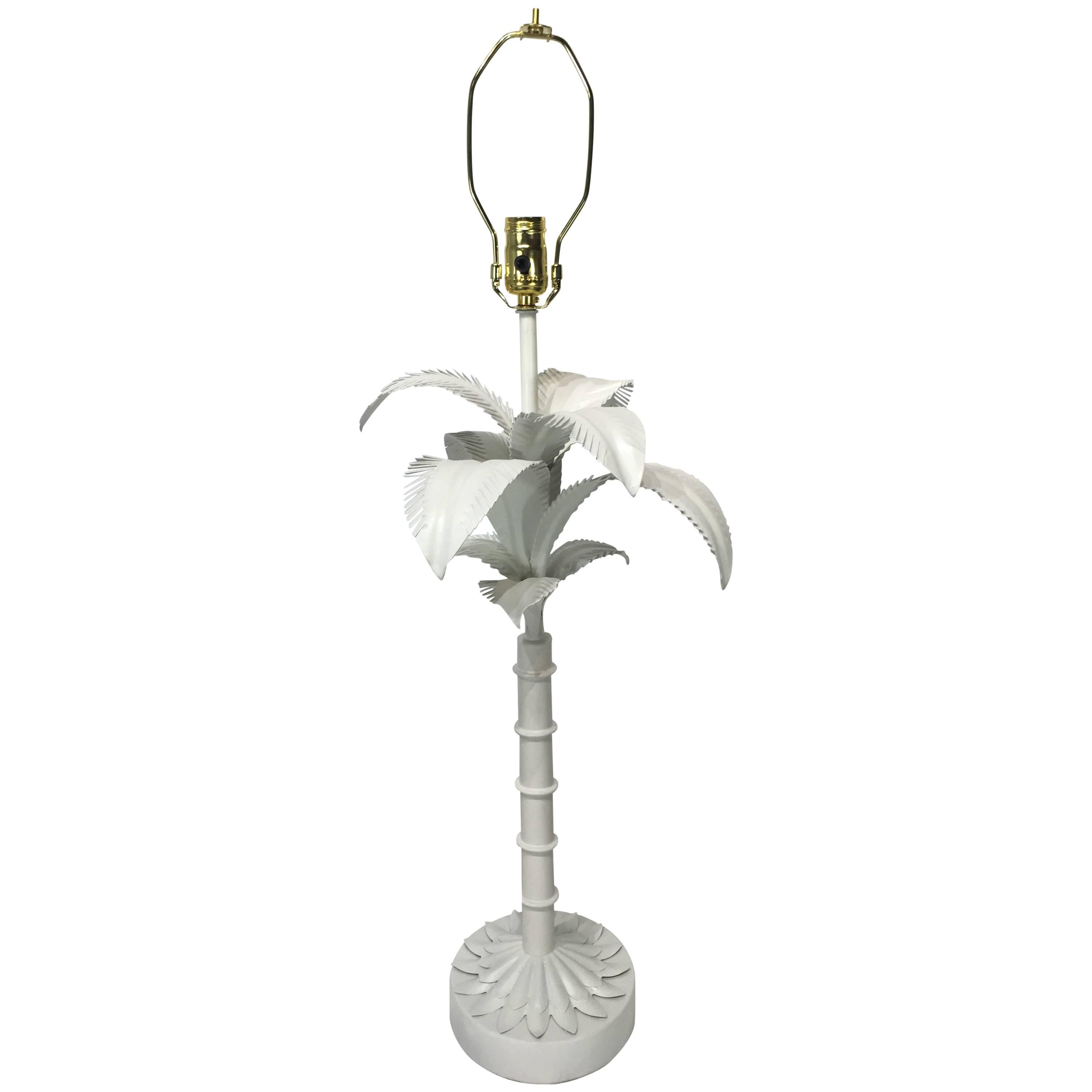 Single palm tree table lamp, of naturalistic form, raised on a circular pedestal base. Shade for display purposes only. 