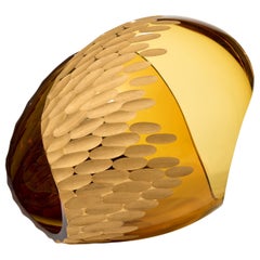 Planet in Cut Gold & Amber, a cut & handblown glass sculpture by Lena Bergström