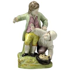 Staffordshire Pottery Figure of Two Boys Scuffling over a Birds Nest, circa 1820