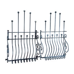 Pair of Mid-20th Century Hand-Forged Iron Window Grilles With Sculptural Scrollw