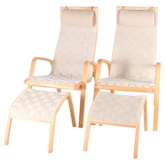 Pair of Scandinavian armchairs and ottomans