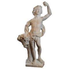 Italian Marble Statue of Bacchus holding a basket  of fruit and flowers