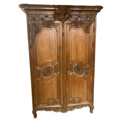 French provincial oak wedding armoire. 19 th c. With carved love birds