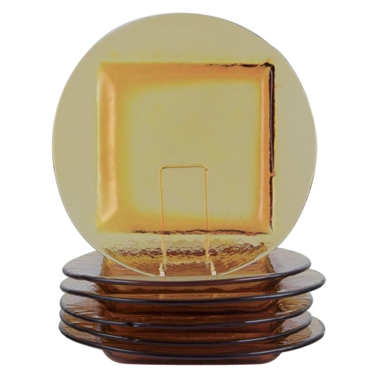 Scandinavian glass designer. Set of six dinner plates in smoke-coloured glass