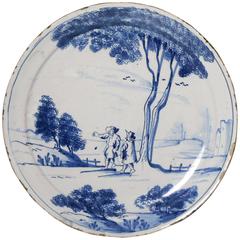 English Delftware Plate with Scene of Two Figures in a Rural Landscape, London