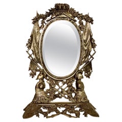 Miroir de table en fonte et fer doré du 19e siècle avec motifs héraldiques et chevaliers