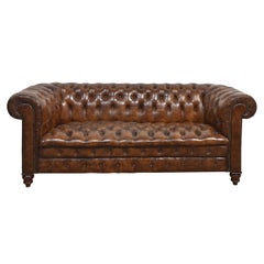 Brown leather deep buttoned chesterfield
